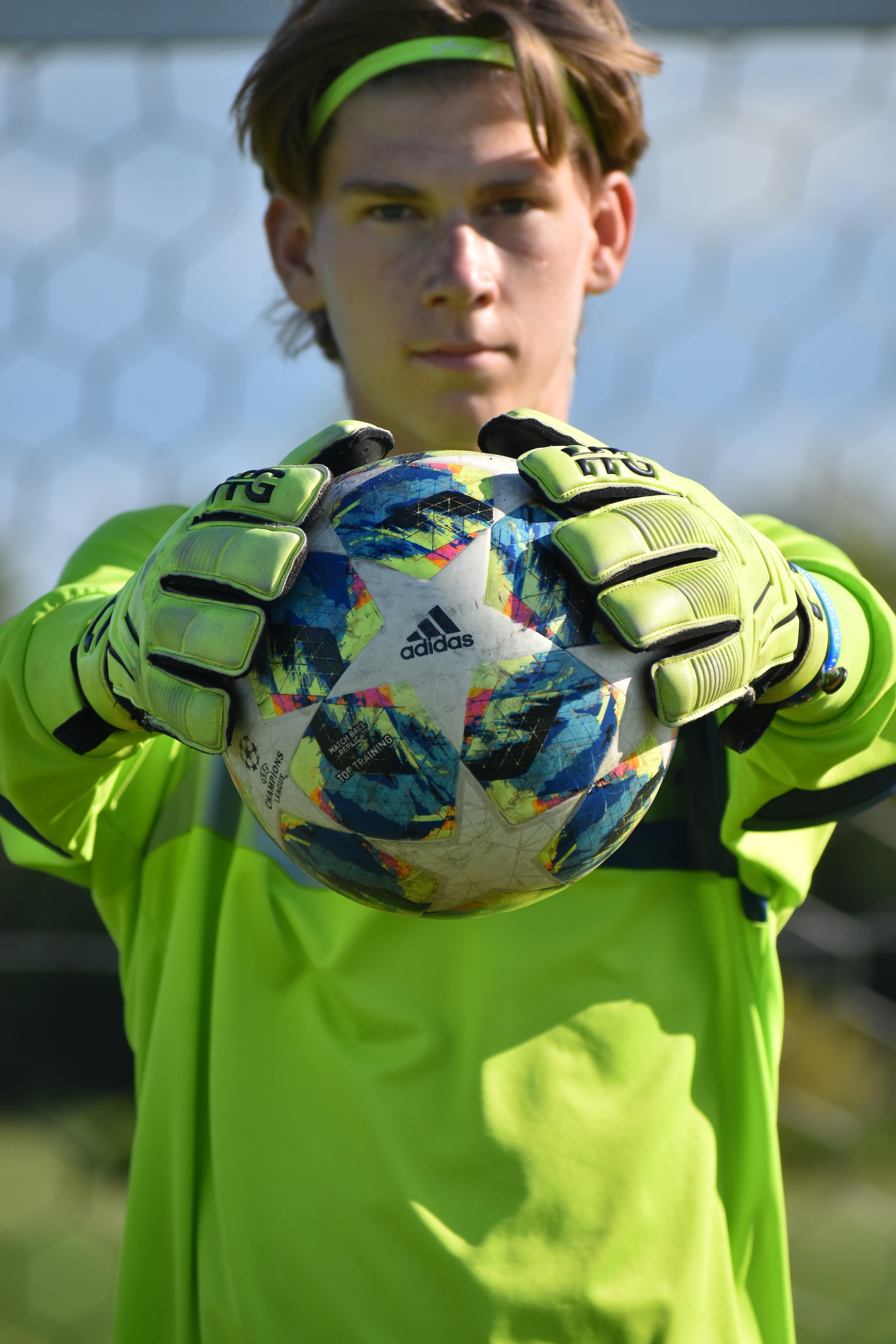 Young goalkeeper holding a ball