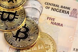 Bitcoins above the nigeria banknotes