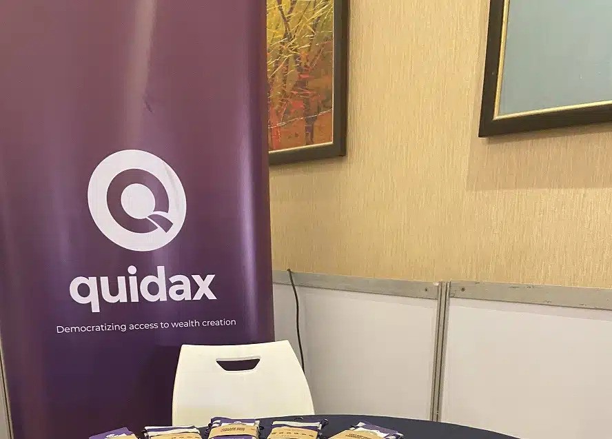 Quidax banner in an office setting